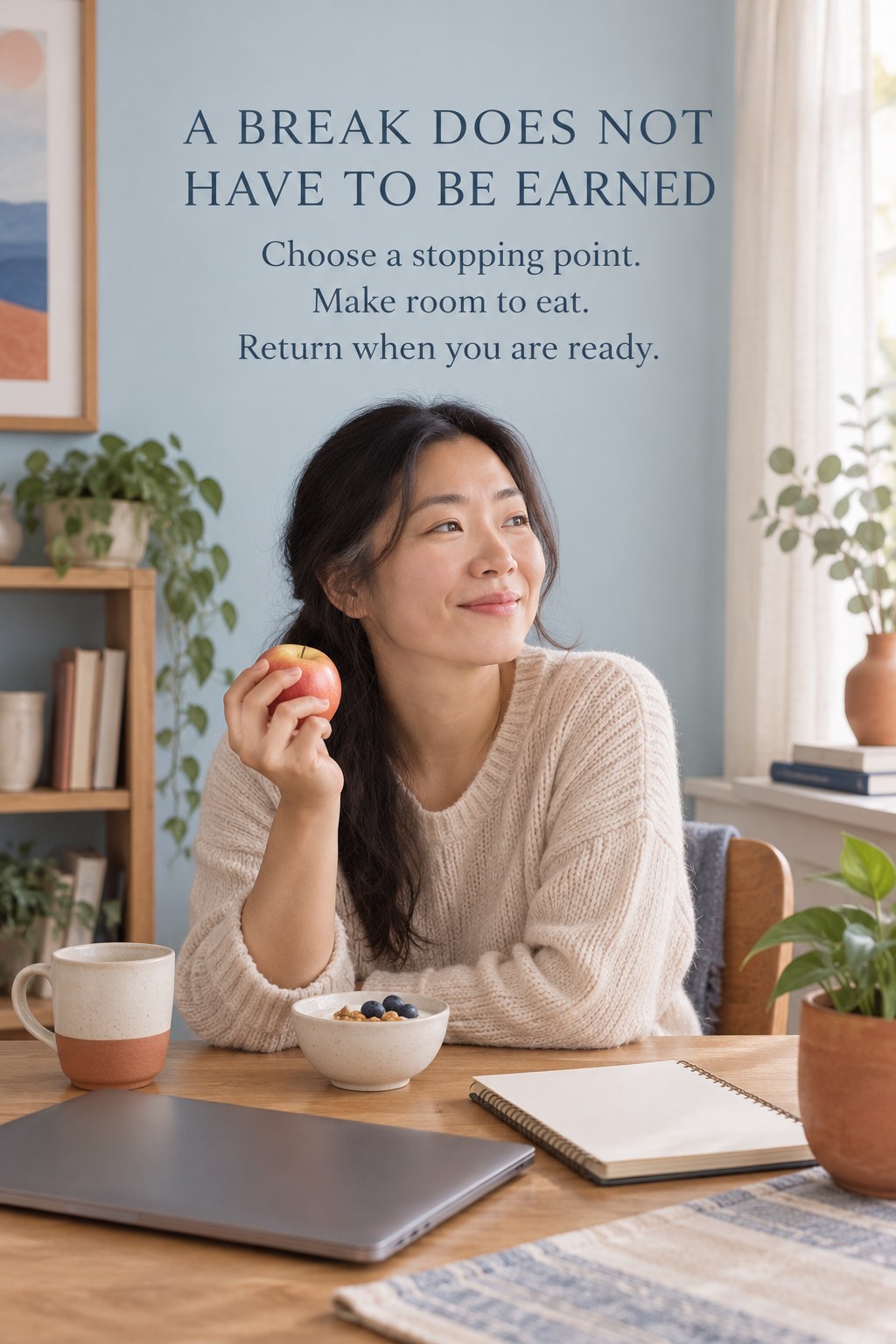 An adult resting at a desk with an apple and yogurt while a closed laptop sits nearby.